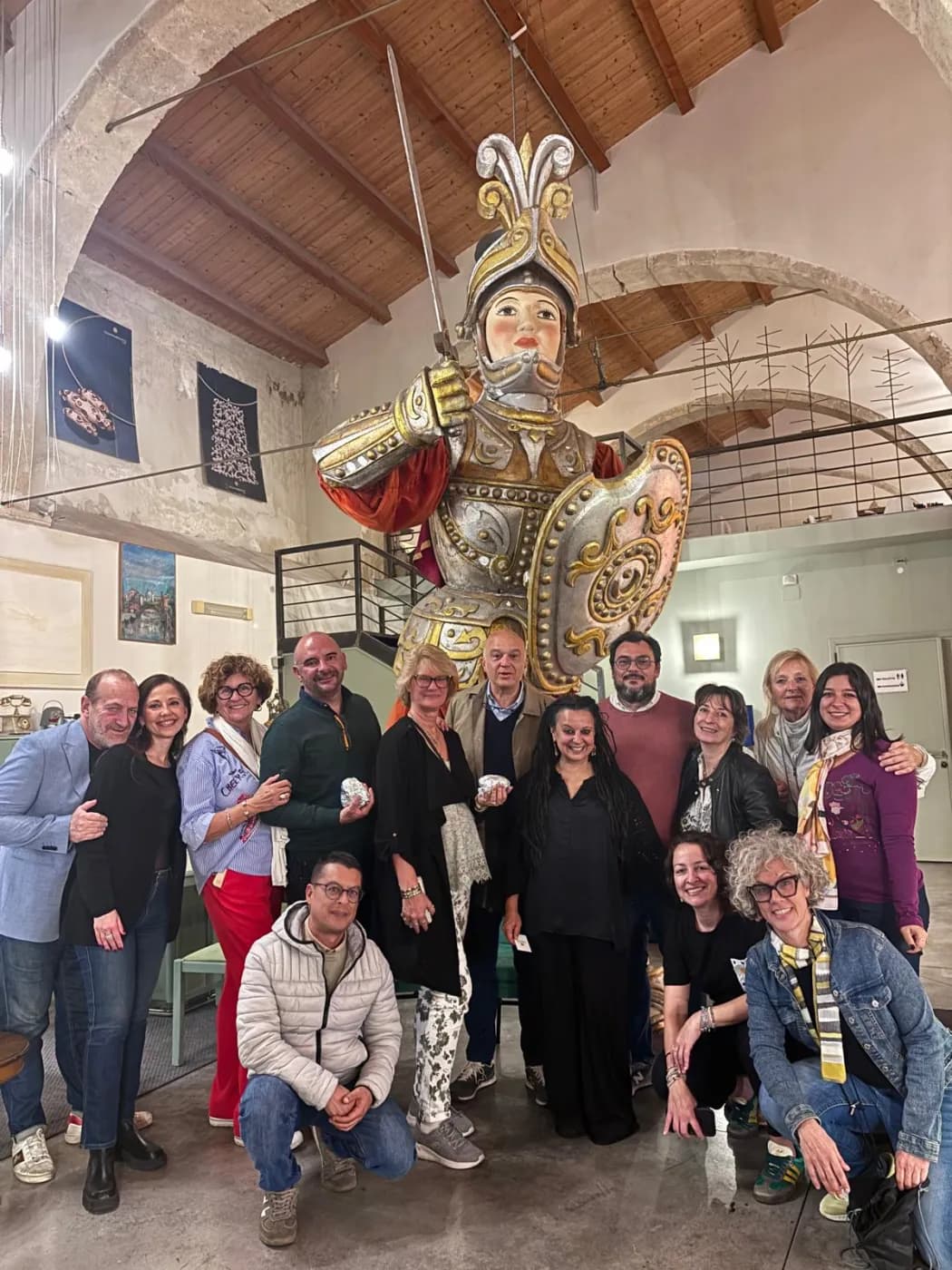 Group photo beside a giant Sicilian puppet